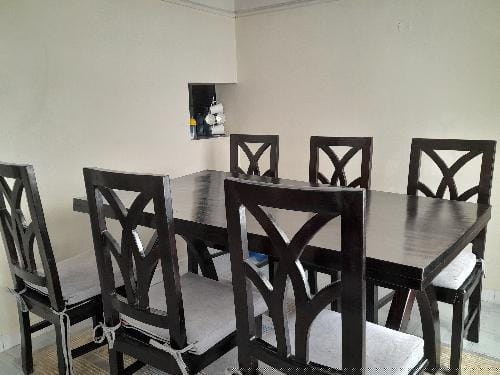 Item : 6 Seater Dinning set-Mahogany  Age : 8 months. Selling Price :40,000 Negotiable  Contact : 07
