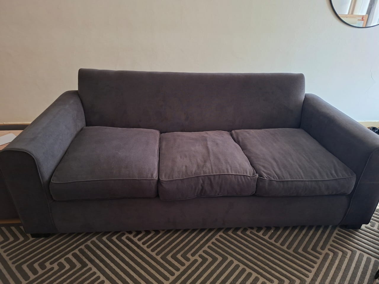 5 seater charcoal grey sofa (3+1+1) - 20,000 2 matching poofs - 5,000 Large textured carpet - 15,000